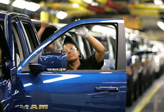 Gallery Michigan auto industry: A female worker checks on Chrysler's new 2009 Dodge Ram pickup