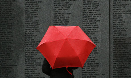 A woman looks at the main headstone in the Lockerbie disaster memorial garden