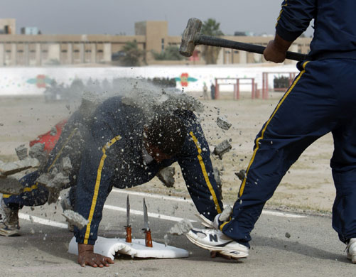 Gallery 24 hours in pictures: Policemen during their graduation ceremony in Baghdad