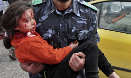 A wounded girl is carried to hospital after Israel's attack on Gaza