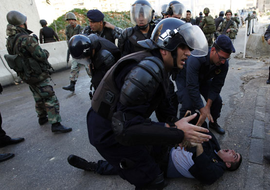 Gallery Gaza air strikes: Lebanese policemen during a riot in front of the Egyptian embassy