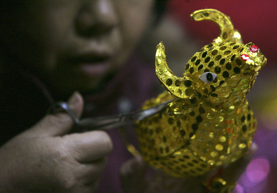 Gallery 24 hours in pictures: Worker makes an ox-shaped lantern at a workshop in Nanjing