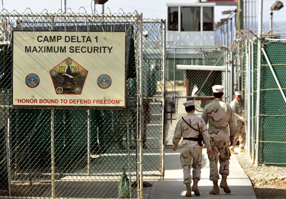 Gallery Guantanamo: U.S. military guards walk inside Camp Delta