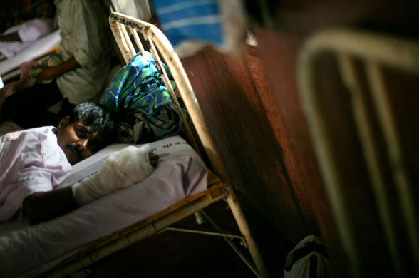 Gallery December 3 2008: Mumbai, India: A wounded man at the JJ Hospital
