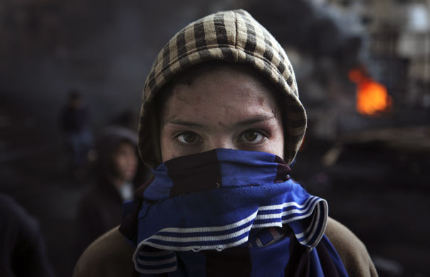 Gallery 30 December 2008: Jerusalem: A Palestinian protester during clashes with Israeli troops