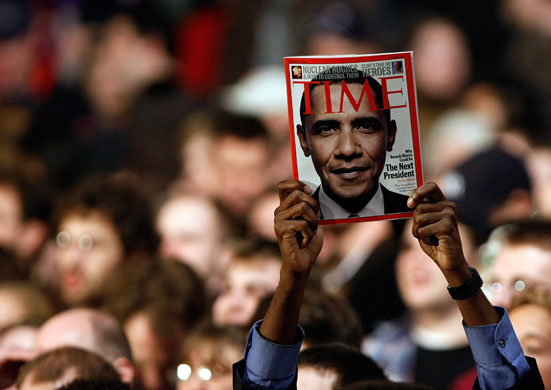 Gallery Tisdall year: Nashua, US: A supporter of Barack Obama holds up a magazine cover