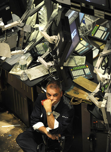 Gallery Tisdall year: A trader on the floor of the New York Stock Exchange