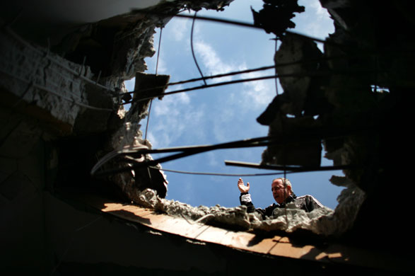 Gallery Gaza: A hole made after a Palestinian rocket hit a school in Beer Sheva, Israel