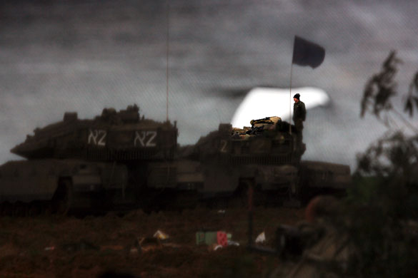 Gallery Gaza: An Israeli soldier stands on a Merkava