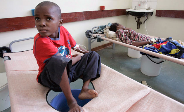 Gallery Zimbabwe cholera: A boy rests on his bed in a cholera ward of Budiriro Polyclinic in Harare