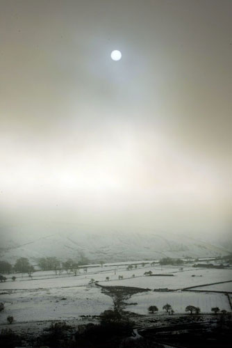 Gallery December snow: The sun tries to break through heavy clouds over Rossendal Valley