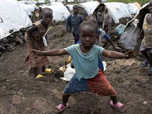Gallery 24 hours in pictures: A boy at one of the Mugungu camp sites near Goma