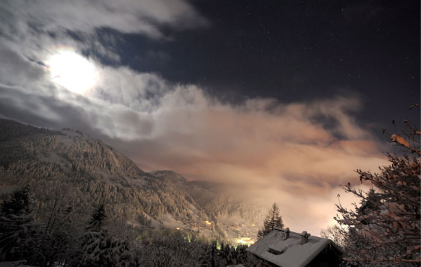 Gallery 24 hours in pictures: The moon rises above snow covered mountains near La Clusaz