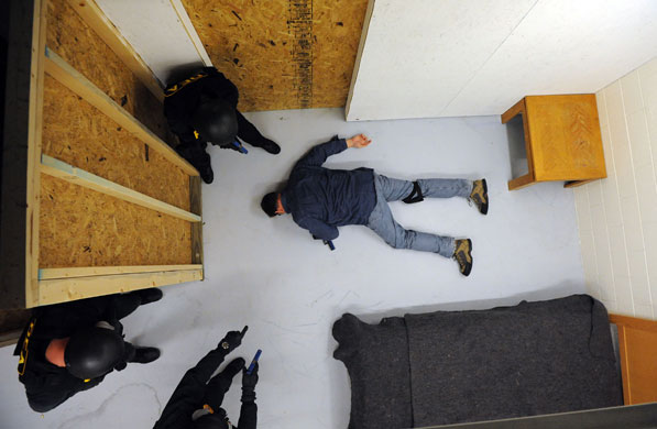 Gallery 24 hours in pictures: DEA agents simulate a raid