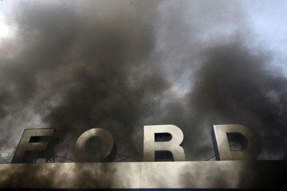 Gallery Riots in Athens: A Ford car dealership burns as youths clash with riot police  in Athens