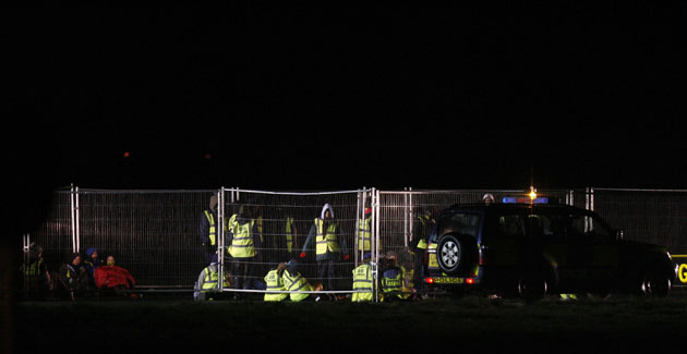 Gallery Stansted airport: Activists sit in an enclosure they built at Stansted 
