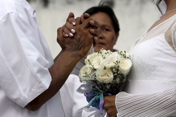 Gallery 24 hours in pictures: Filipino prisoners during a mass wedding ceremony