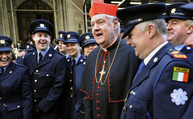 Edward Cardinal Egan shares a laugh with the  Irish police force during the St Patrick's Day parade in New York