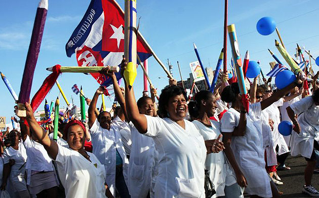 Cubans march during the annual May Day parade at the Revolution square in Havana, Cuba