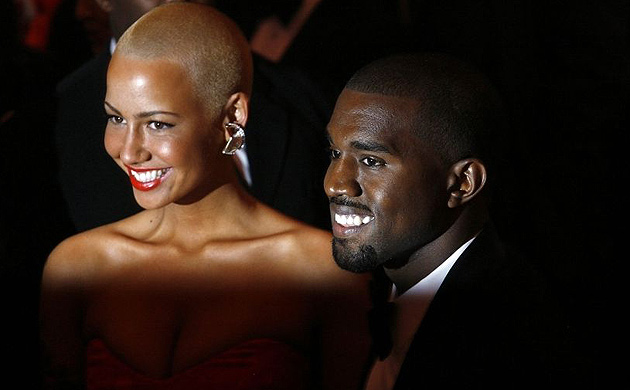 Kanye West and Amber Rose smile for the cameras at the Metropolitan Museum of Art's costume institute 