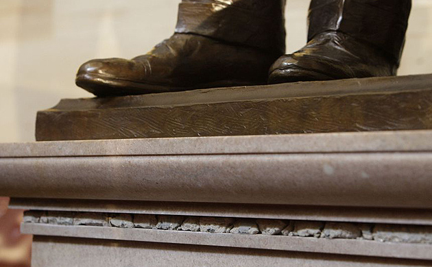 Small pieces of the Berlin wall can be seen in the base of the Ronald Reagan statue after an unveiling ceremony, Wednesday, June 3, 2009, in the Rotunda of the Capitol in Washington.