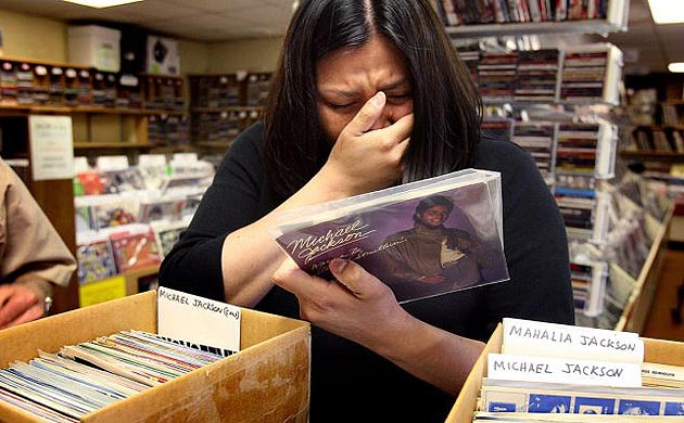 Bernadette Gillies cries while browsing through Michael Jackson records at Randy's Records & CDs in Salt Lake City, Utah 