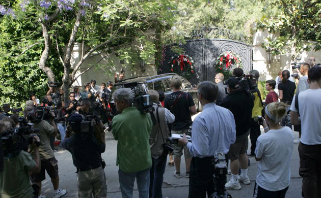 Media and fans gather near the home of pop star Michael Jackson in Los Angeles.