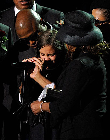 Paris Katherine Jackson, Michael Jackson's daughter, is comforted by Randy Jackson, left, and Rebbie Jackson during her father's memorial service in Los Angeles.
