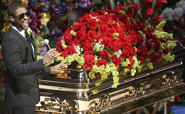 Usher performs next to Michael Jackson's casket during the service