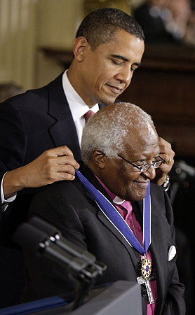 Archbishop Desmond Tutu is presented with the presidential medal of freedom by Barack Obama at the White House