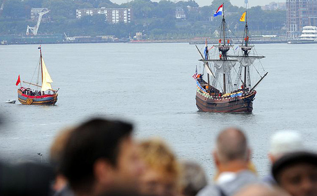  A replica of the Half Moon, Henry Hudson's ship, leads a flotilla of ships up the Hudson River
