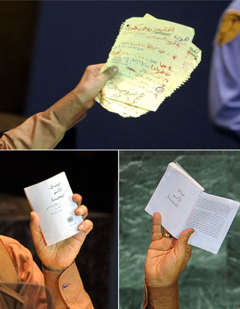 Muammar Gaddafi holds a stack of speech notes, top, and a copy UN charter during his speech at the UN general assembly 
