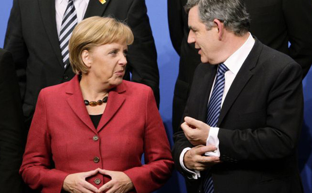 Angela Merkel talks to Gordon Brown during a group photo at the Pittsburgh G20 summit in Pittsburgh,