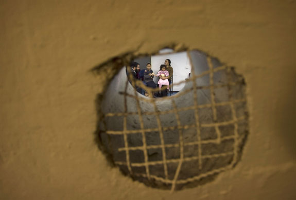 Gallery 24 hours: Israelis are seen through a window
