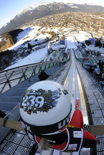 Gallery 24 hours: Norway's Romoeren prepares to speed down the ski 