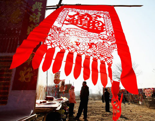 Gallery 11 January 2009: Vendors of decorative festival posters wait for customers