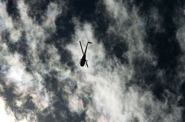 Gallery 11 January 2009: Vara Blanca: A rescue helicopter flies over the epicenter of an earthquake