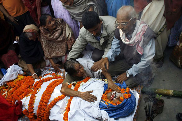 Gallery 11 January 2009: Guwahati: Relatives console the mother of a man injured in a bomb blast