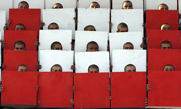Gallery 12 January 2009: Baghdad: Military cadets hold placards during a graduation ceremony