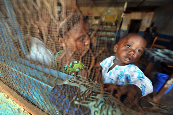 Gallery 12 January 2009: Gbarnga, Liberia: A young mother and her son at a health centre