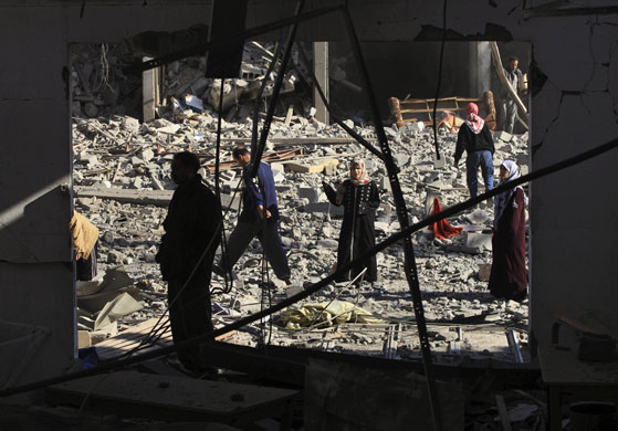 Gallery Gaza conflict continues: Palestinians gather following an Israeli airstrike in Gaza Cit