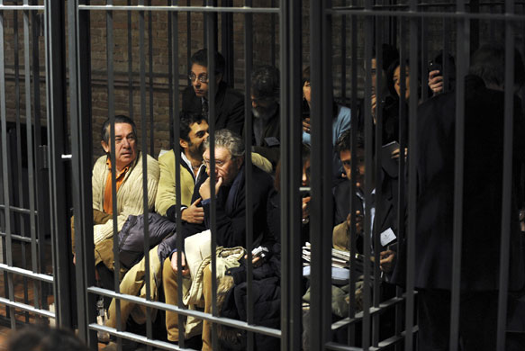 Gallery Meredith Kercher trial: Journalists covering the trial sit in a cage normally meant for prisoners