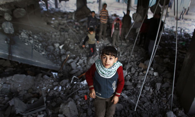 Gallery 24 hours in pictures: Young boys play in the rubble of the Al-Abrar mosque