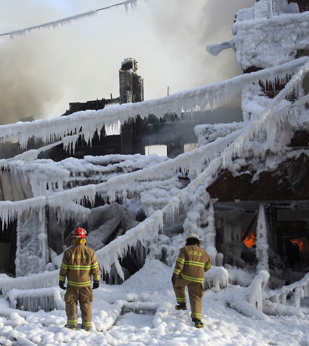 Gallery 24 hours in pictures: Firefighters after a fire broke out in sub-zero temperatures