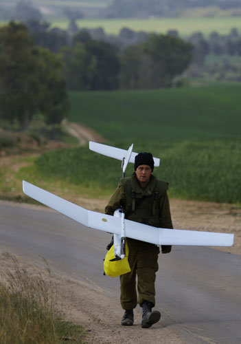 Gallery Withdrawal from Gaza: An Israeli soldier carries an observation plane 