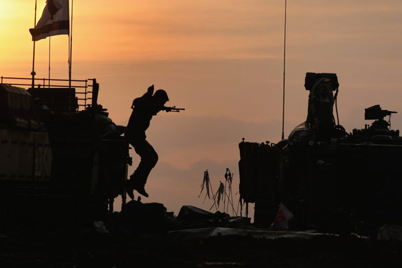 Gallery Withdrawal from Gaza : An Israeli soldier jumps down from an APC