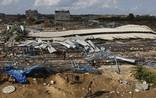 Gallery Gaza then and now: A Palestinian man walks past a destroyed chicken farm