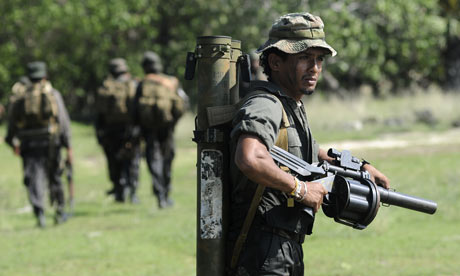 Soldiers walk in Poonaryn