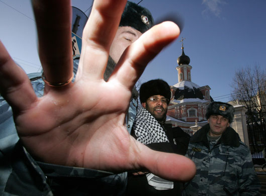 Gallery 24 hours in pictures: Russian riot police detain a Muslim protester