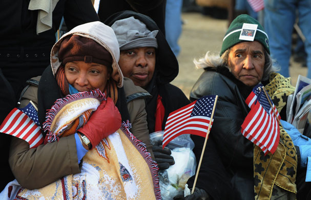 Gallery Inauguration Day crowds: A family from Virginia tries to stay warm as they wait on the National Mall
